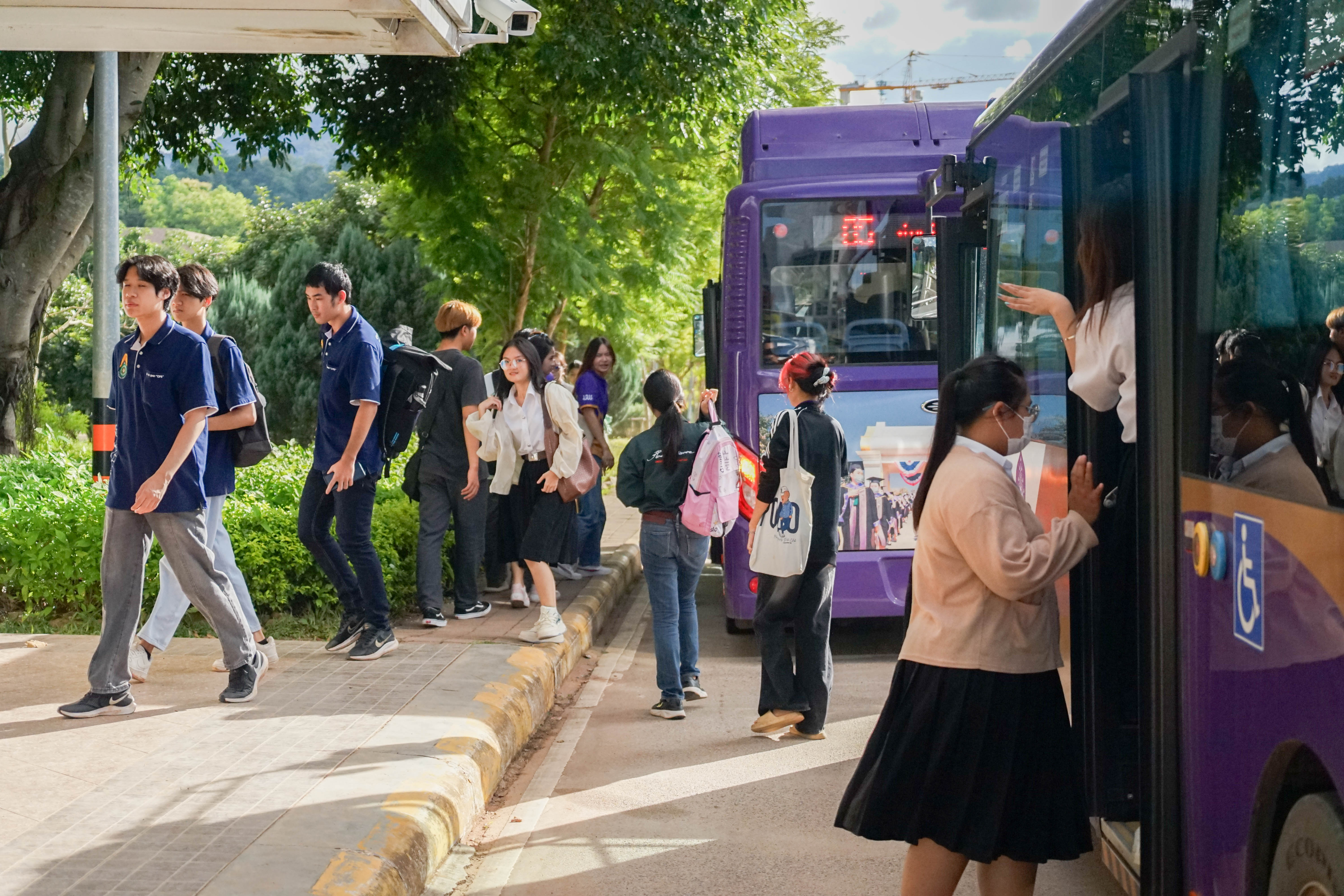 Students boarding electric bus