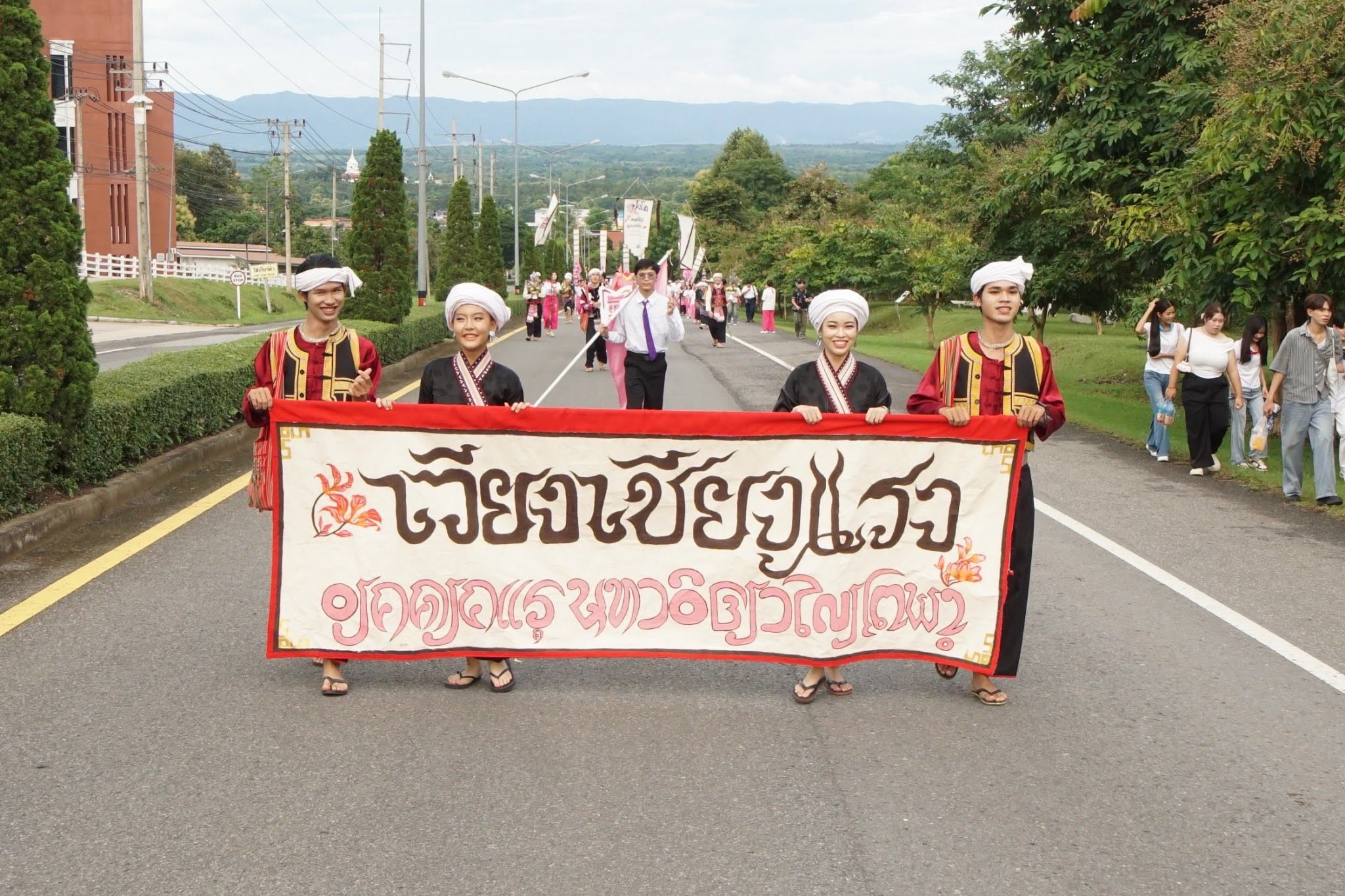 Students marching in the walking into university traditional activity 2025