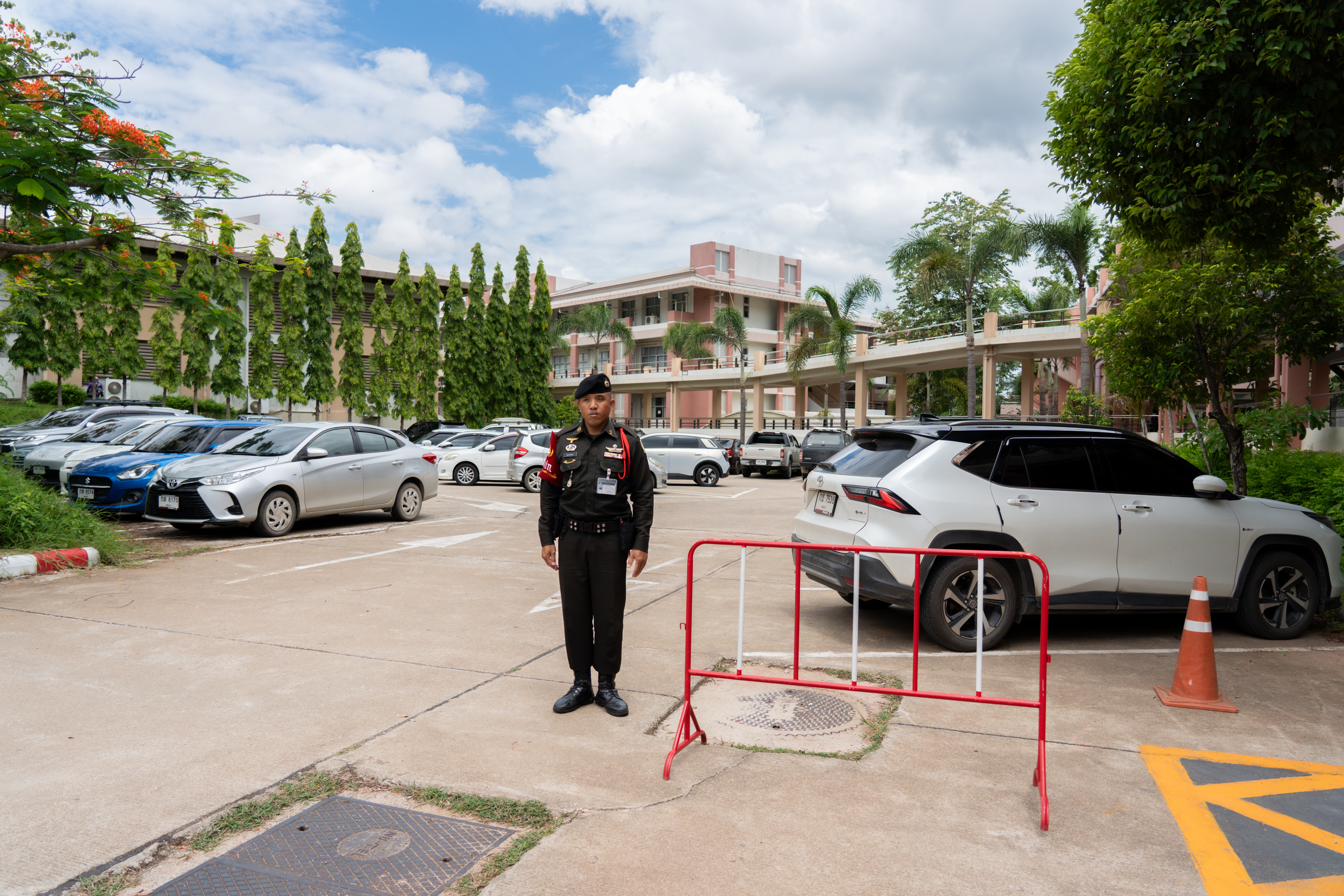 Security officer at campus parking checkpoint, University of Phayao