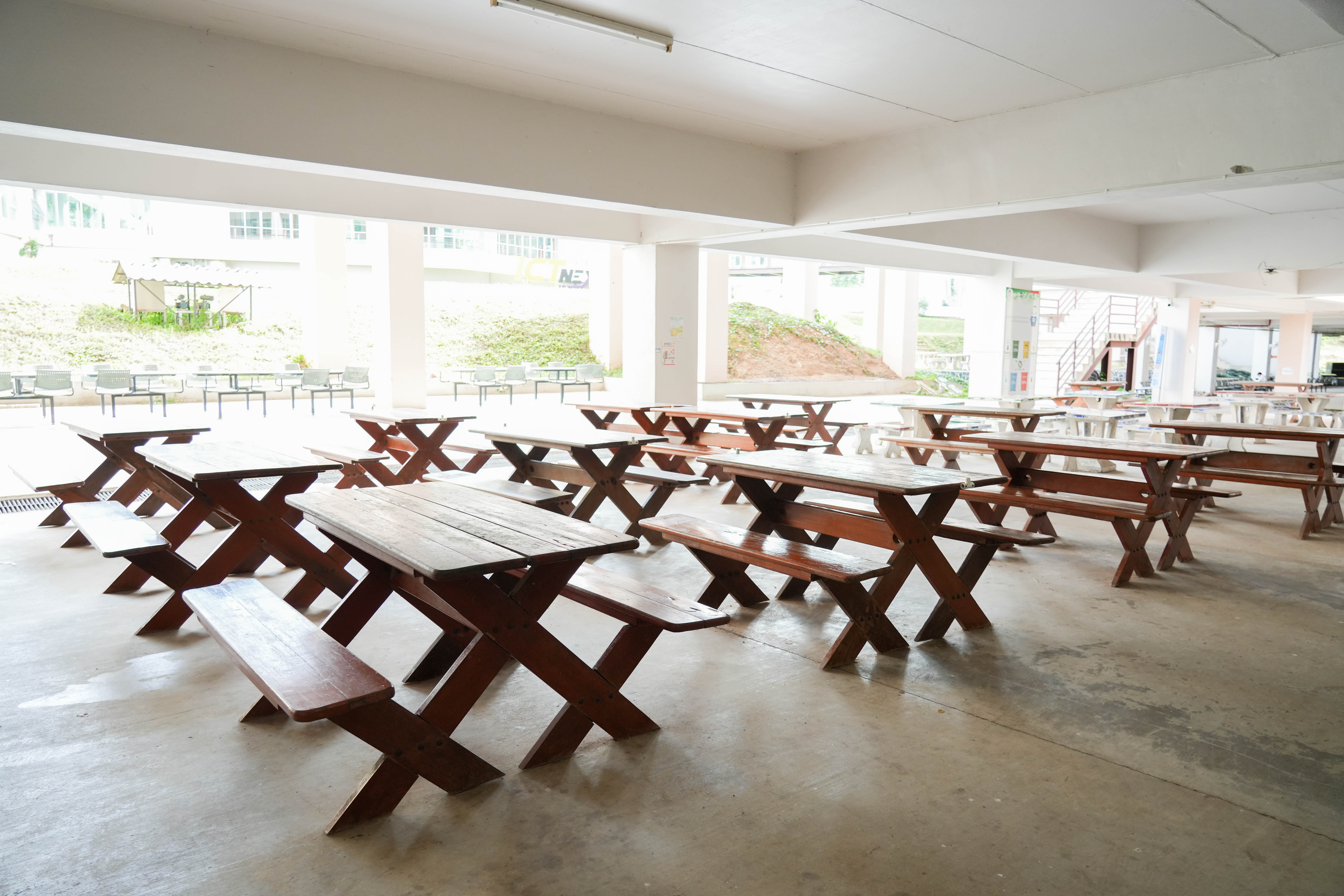 Picnic tables in shaded space