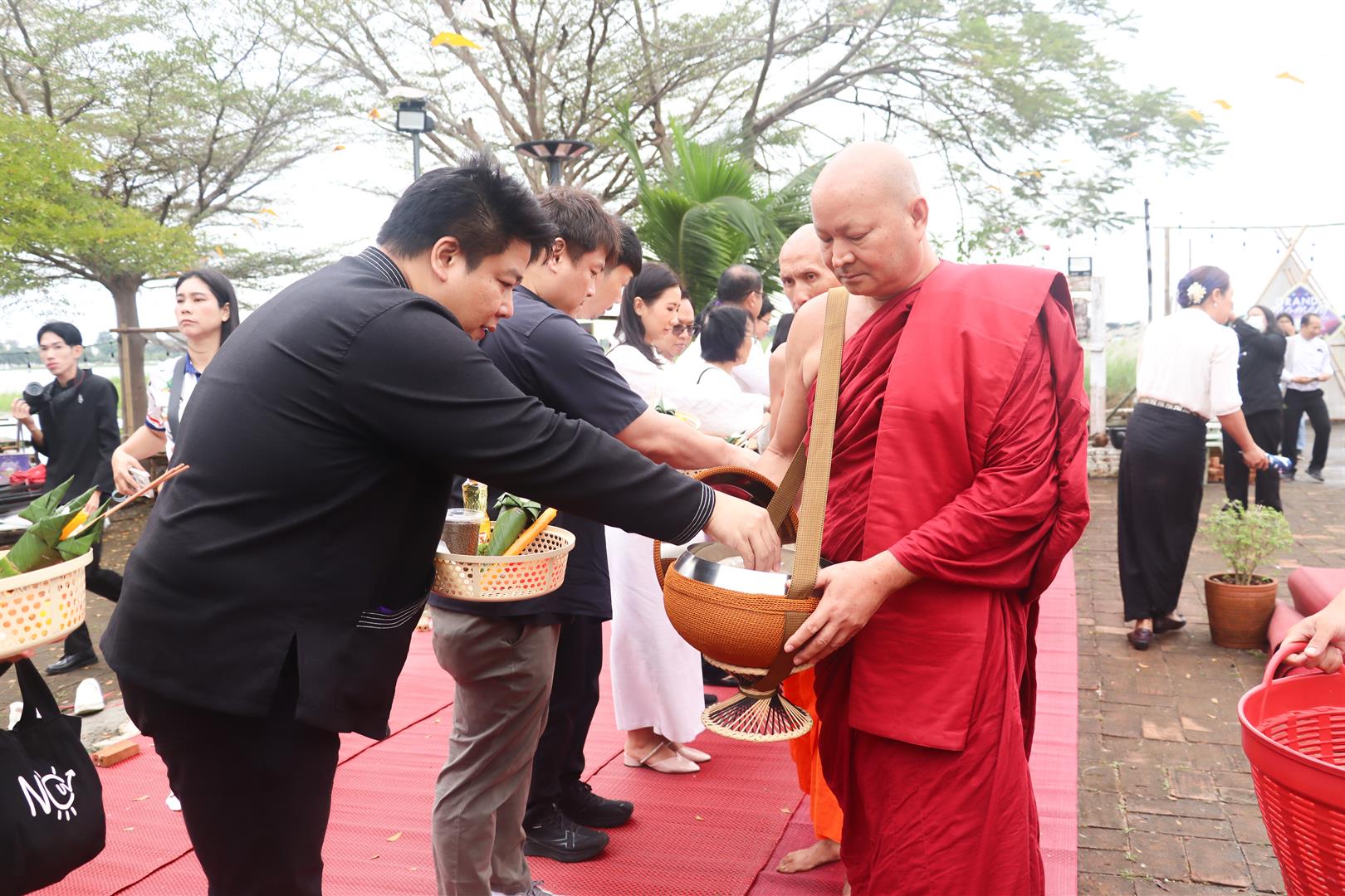 Alms offering to monks at Wat Tilok Aram for Moments of Remembrance