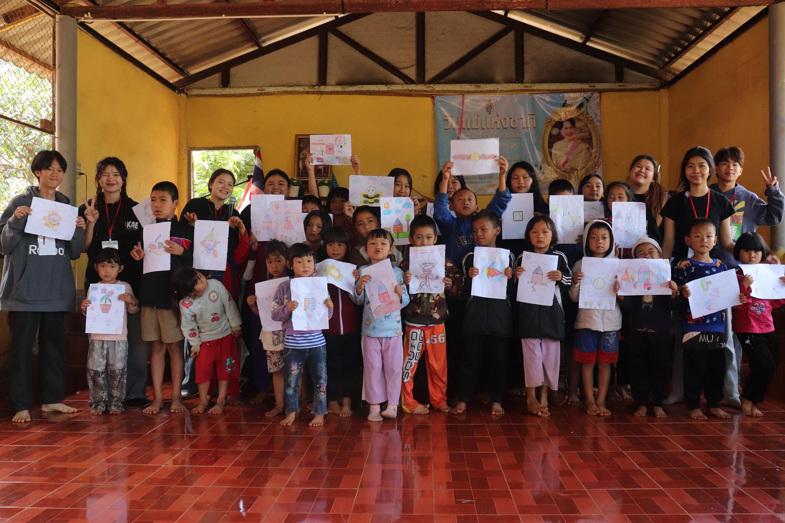Students engaging with children at Ban Mae Om Lan School