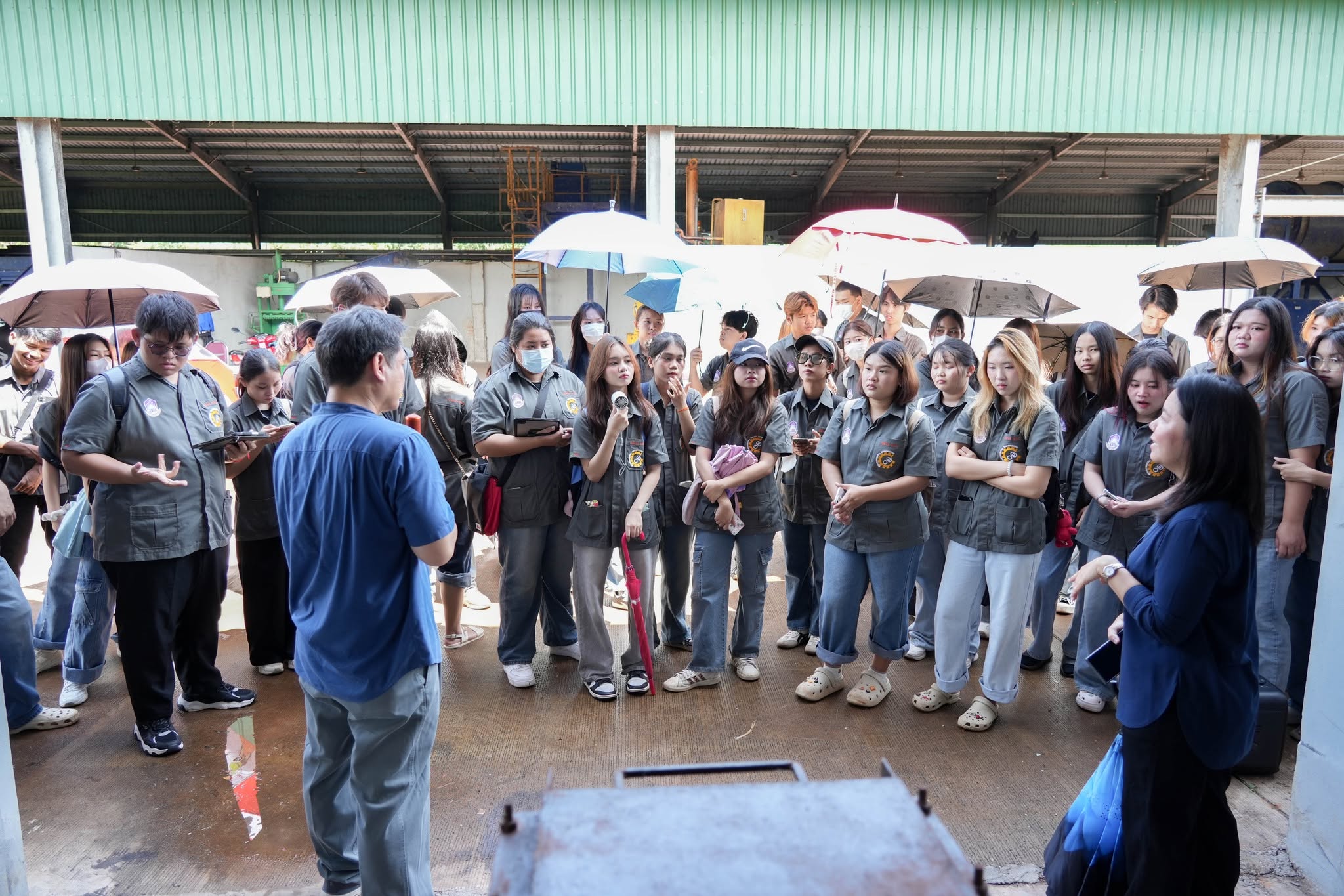 Students gathered outdoors during a waste management course field visit